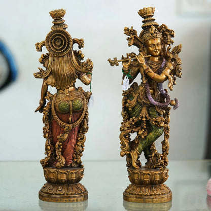 Pair of Brass Statues: Man Playing Flute and Woman Holding Flower