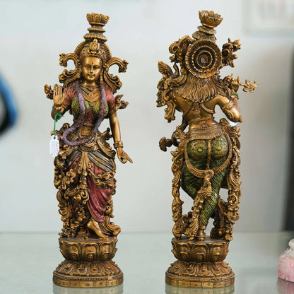 Pair of Brass Statues: Man Playing Flute and Woman Holding Flower